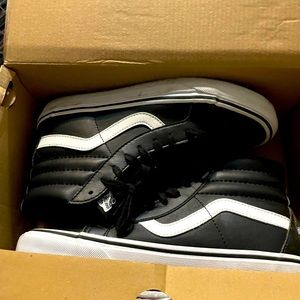 Faux leather vans high tops.